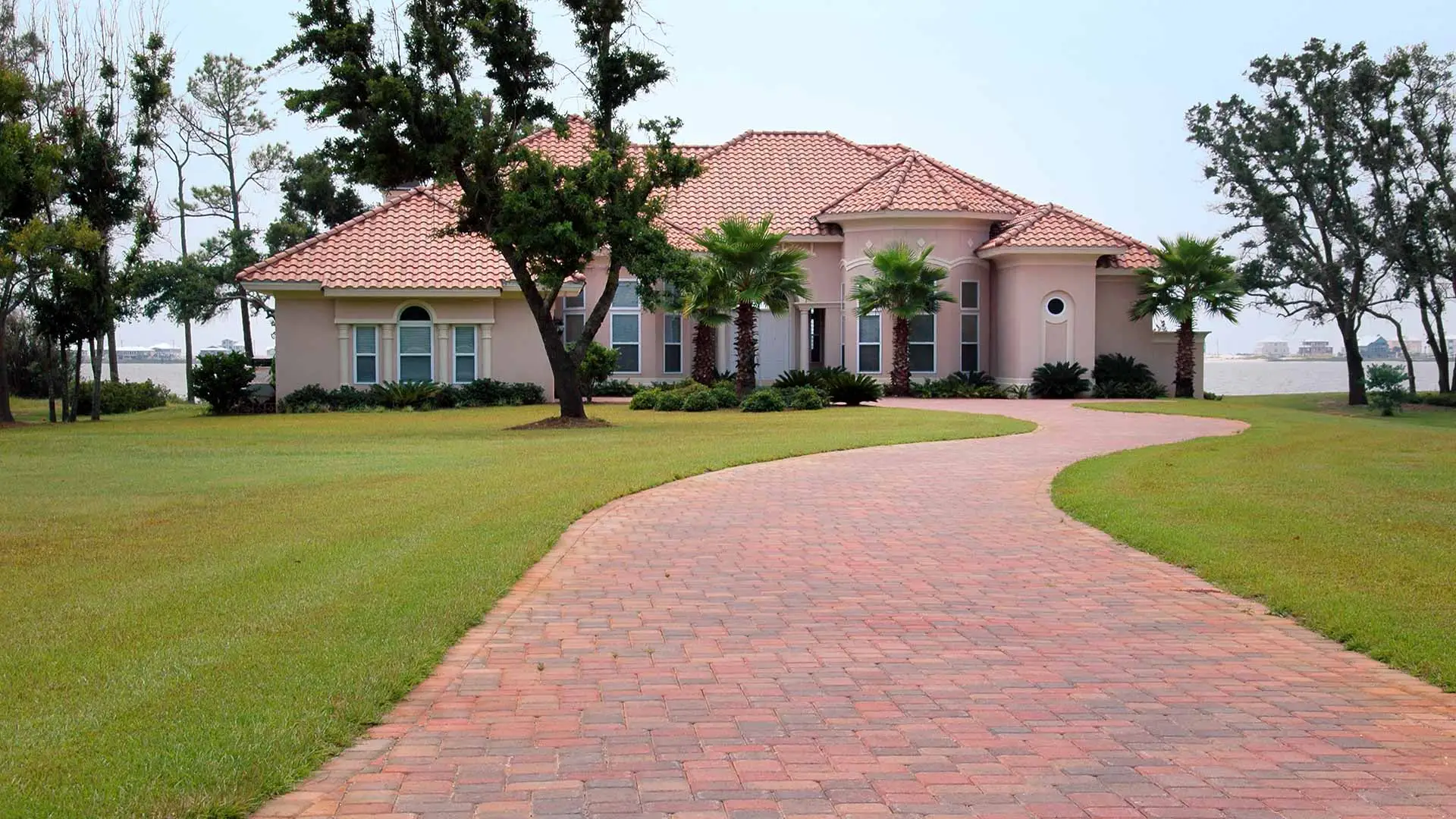 Beautiful decorative paver driveway leading up to a house in Orlando, FL.