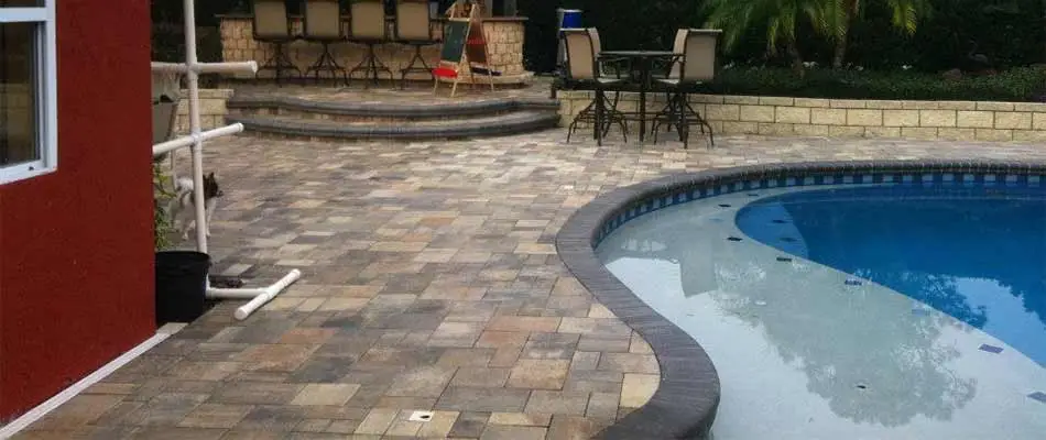 Custom patio construction around a home pool in The Villages, FL.