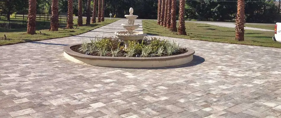 New driveway installed with decorative pavers at a residential property in The Villages, FL.