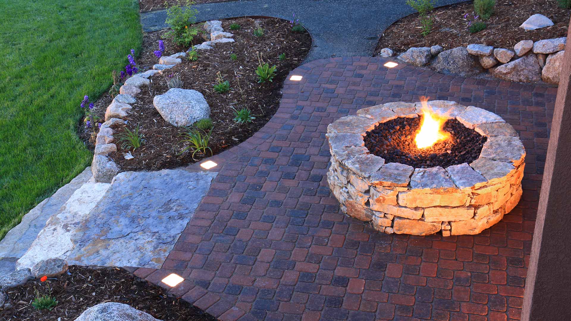 Custom fire pit and patio installation at a Orlando, FL home.