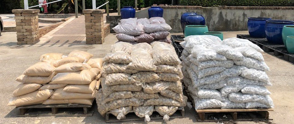 Bags of mulch and rock available for pick up at our nursery in Orlando, FL.